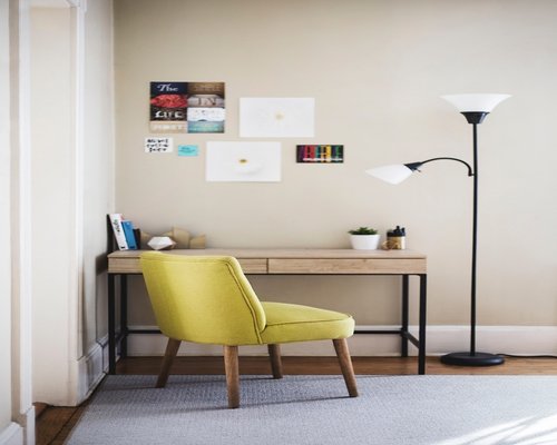 Dimmed living room with cozy corner lamp